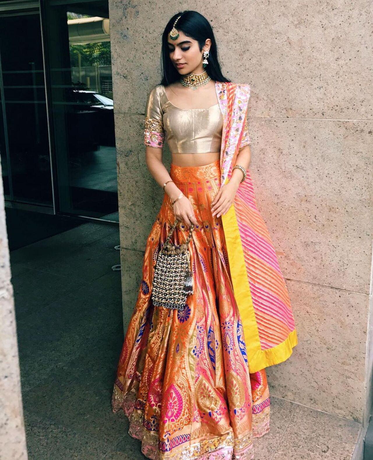 Khushi stuns in a richly styled orange ghaghra that oozes royalty. With intricate detailing and a youthful charm, her look is a must-try for sangeet-inspired Navratri dressing.